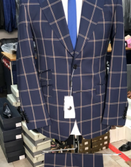 Navy 2 button super 150 Cerruti windowpane wool suit with wide 5 inch hand stitched peak lapel, slanted ticket pocket, flat front pant, double vent. Slim fit. Available in sizes: 38-50 Reg/Long