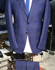 Navy plaid 2 button super 150 Cerruti wool suit with wide 5 inch hand stitched peak lapel, slanted ticket pocket, flat front pant, double vent. Slim fit. Available in sizes: 38-50 Reg/Long