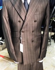 Grey pinstripe super 150 Cerruti double breasted wool suit with wide 5 inch hand stitched peak lapel, slanted ticket pocket, flat front pant, double vent. Slim fit. Available in sizes: 38-50 Reg/Long