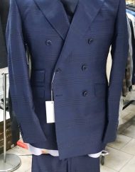 Navy plaid super 150 Cerruti double breasted wool suit with wide 5 inch hand stitched peak lapel, slanted ticket pocket, flat front pant, double vent. Slim fit. Available in sizes: 38-50 Reg/Long