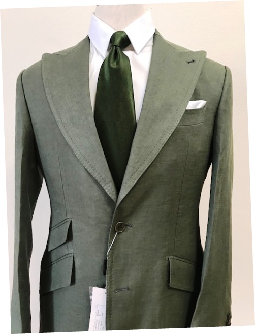 Hunter green linen suit with wide 5 inch peak lapel double stitched, ticket pocket, side buckle on pant. Available in size: 38, 40, 42, 44, 46, 48, 50 Reg/long