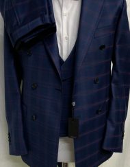 Navy/red 3 piece windowpane super 150 Cerruti wool suit with double breasted vest, double vents on suit,wide peak lapel double hand stitched, slanted ticket pocket, soft Neapolitan structured shoulders, flat front pant. Available in sizes 36-54 regular and long including custom bespoke.