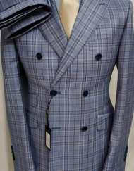 Light blue plaid super 180 Tombojlini double breasted wool suit with wide peak lapel, hand stitched, ticket pocket, 10 inch double vents, fitted jacket and pant. Available in size 36-50 regular or long. Made in Italy.