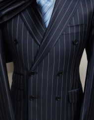 Navy blue super 150 Cerruti 1881 wool Neapolitan double breasted suit. Ticket pocket, slim fit, double vents, wide peak lapel hand stitched. Available in sizes 36-50R and long. From Winstonandlee.com