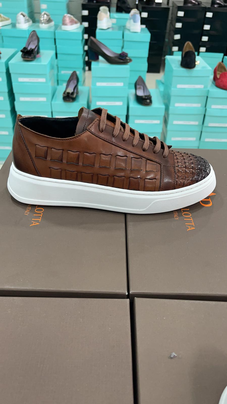Brown burnish all leather woven sneaker. Made in Italy. Five colors to pick from. Comfortable and fashionable. Available in sizes 7-13
