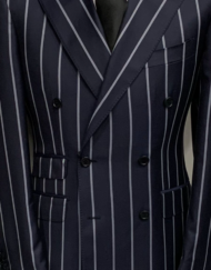 Navy super 150 Cerruti double breasted bold pinstripe wool suit. Wide peak lapel single stitched, ticket pocket, double back vents, flat front pant. Available in size: 40-60 R/L.