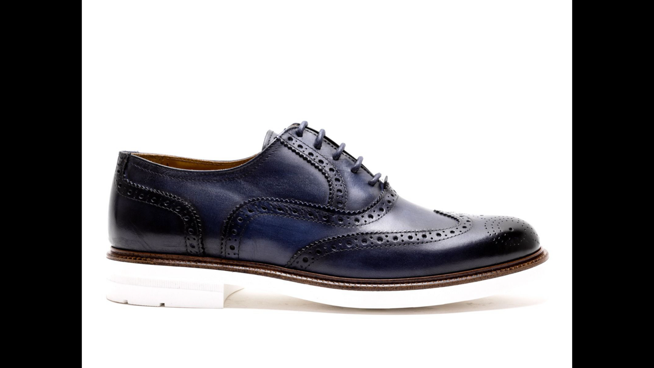 Blue all leather upper wing tip oxford derby lace up with perforated toe. With patent white rubber sole for men. Fashionable and comfortable. Leather insole. Available in size 7-13 and custom for big and tall sizes. Hand made in Italy.