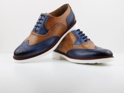 Blue and tan all leather two tone wingtip oxford derby lace up for men. Fashionable and comfortable. Leather insole. White rubber sole with traction grip. Available in size 7-13 and custom for big and tall sizes. Hand made in Italy.