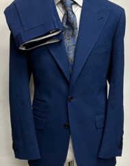 Navy blue luxury seersucker cashmere Ariston soft cotton suit. Wide 5 inch peak lapel double stitched. Ticket pocket, double vent jacket, open button sleeves. Flat front pants. Limited quantity made in size 40-60 R/L