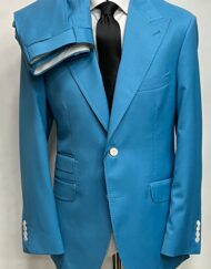 Ice blue luxury super 150 Cerruti wool suit with 5 inch peak lapel double stitched. Ticket pocket, double vent jacket, open button sleeves. Flat front pants. Limited quantity made in size 40-60 R/L. We can change the button to match your style for additional cost